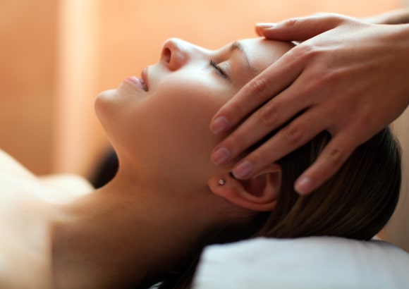Woman enjoying an in-home Swedish massage