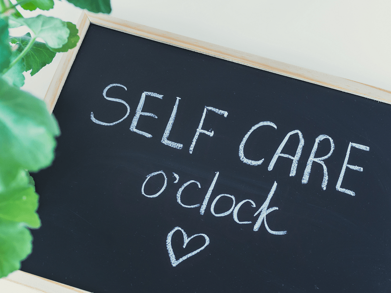 A picture of the word self-care that represents the benefits of add massage and yoga to your self-care routine