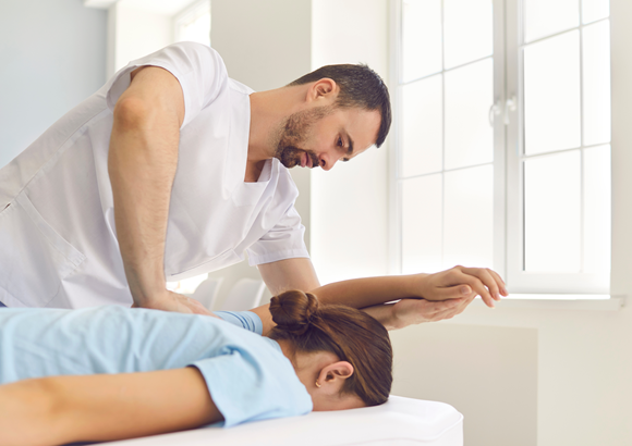 A woman getting a medical massage in her home