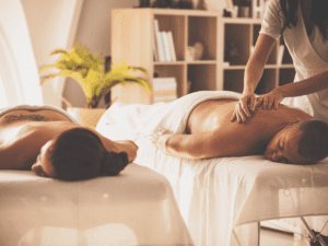 A couple enjoying a couples massage at their home in Laughlin, NV