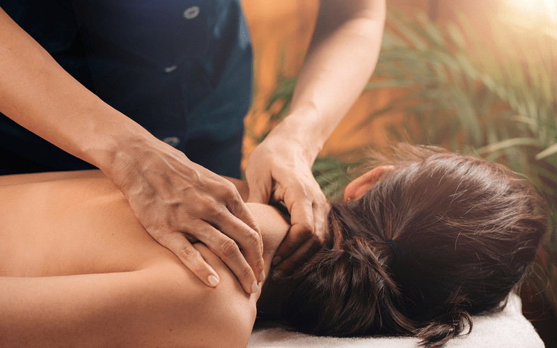 An in-home female massage therapist from Las Vegas is getting a deep-tissue mobile massage while on vacation in Los Angeles