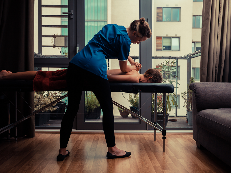A woman getting an on-demand mobile massage in Los Angeles
