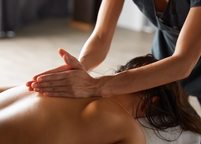 A woman having a massage after her yoga class