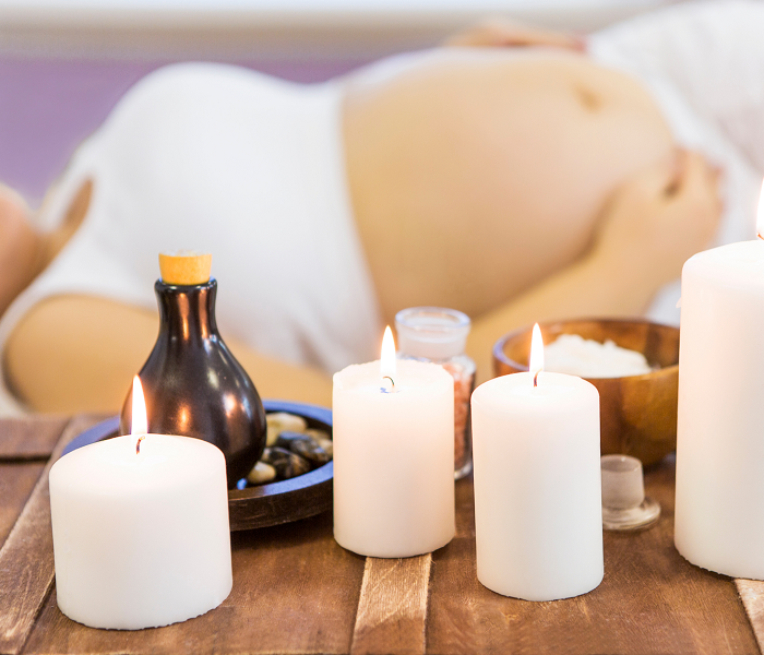 A woman from Las Vegas getting a prenatal massage in at her home in Los Angeles after doing a prenatal massage near me search online