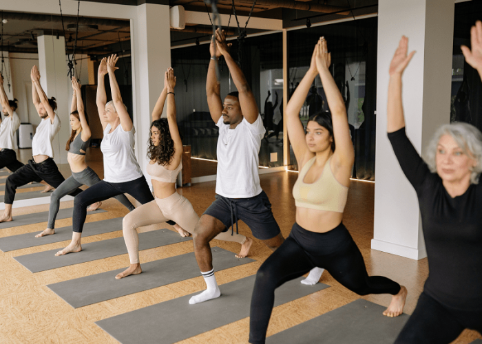 A group of friends from Los Angeles and Las Vegas taking a yoga class